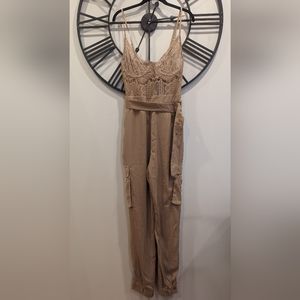 FASHIONNOVA: Kora Lace Jumpsuit with fringe along the top.